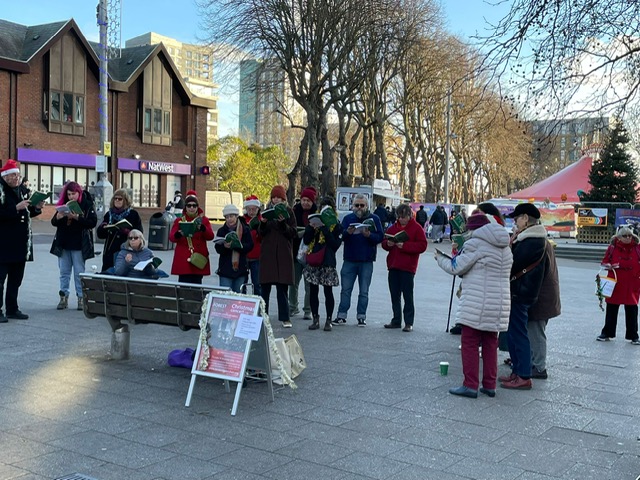 Carol singing for the Night Shelter